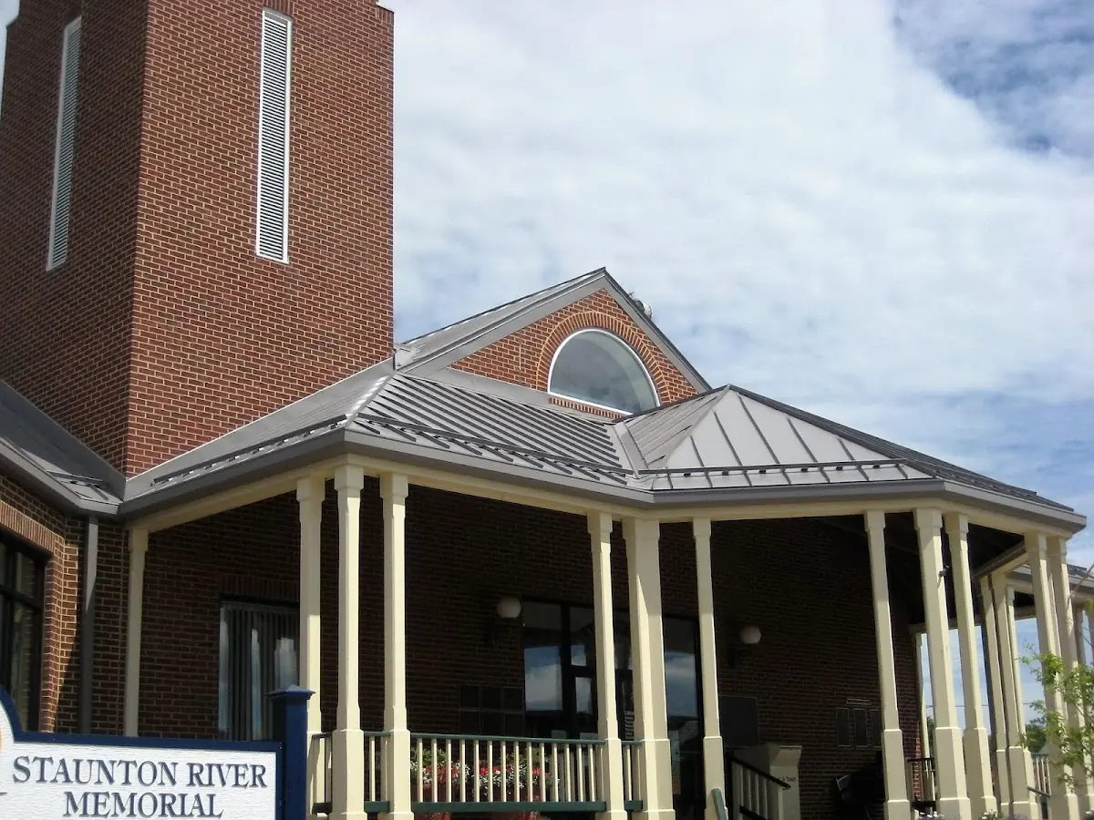 Skilled roofing craftsmen working on a residential roof in Kingston
